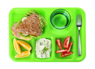 Serving tray with healthy food on white background, top view. School lunch