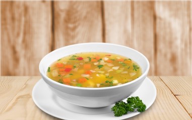 Bowl of delicious vegetables soup on  table