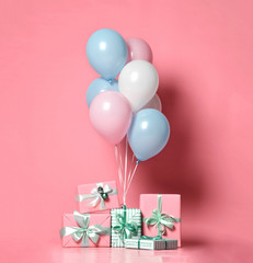 Helium inflatable latex pastel color light blue pink white balloons and present gifts  background