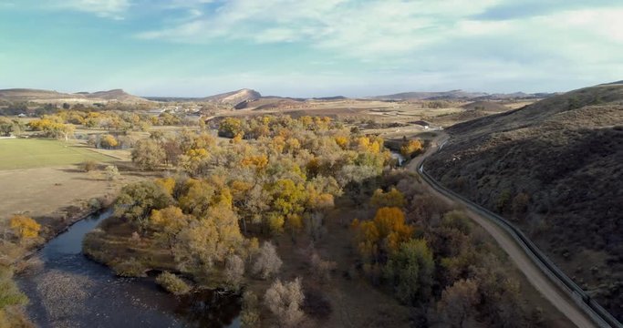 Cache la Poudre River and water diversion ditch (Charles Hansen Canal) at Rocky Mountain foothills in northern Colorado above Fort Collins, fall scenery