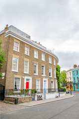 Notting Hill houses in the famous Portobello Road market, west London, United Kingdom.