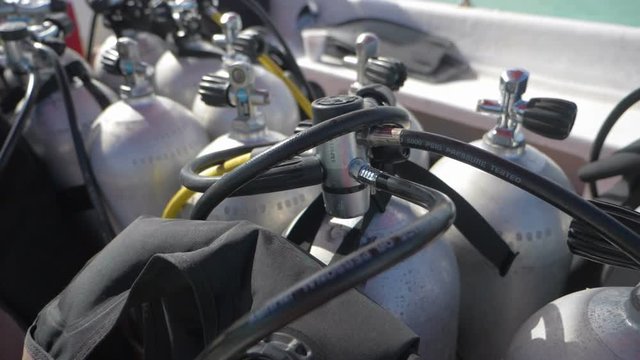 Scuba diving air tanks on the boat, slow motion