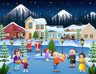 Fototapeta na wymiar Cartoon of happy kid and family playing in the snowing village