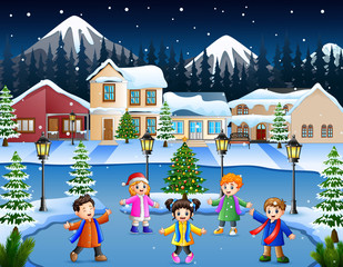 Obraz na płótnie Canvas Happy kid group singing in the snowy village