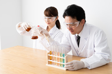 asian reseacher working in lab