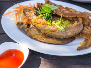 Fried fish with vegetables and chili sauce