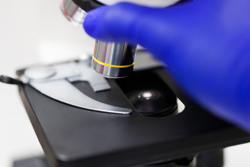 Scientist hands with microscope, examining samples, Concept science and Technology