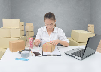 business owner woman working online shopping prepare product packaging process
