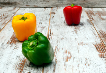 Colorful peppers surrounded by rustic background