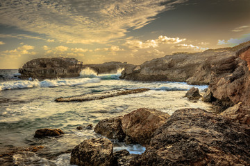 sunset on coast of sea