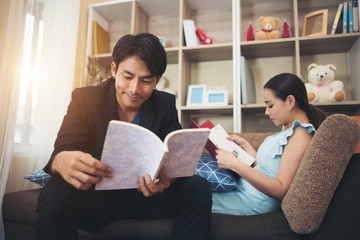 Cheerful Happy couple relaxing in sofa at home