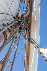 Obraz premium Looking up the mast at the yard, sails, and rigging of a 3-masted schooner on its way to the Island of Nicklösa in the Åland Islands, Finland.