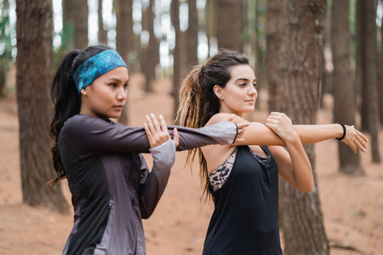 woman stretching and exercising in nature