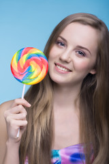 Beautiful young women with multicolors lollipop