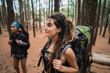 Fototapeta na wymiar young woman hiker enjoying trekking in a woods
