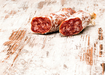 Sausage surrounded by rustic background