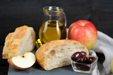apples, olives, olive oil and ciabatta