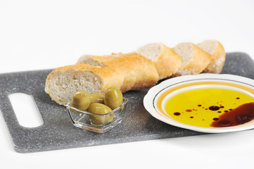 olives, baguette and olive oil