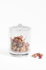 dried rose flowers in a glass ja