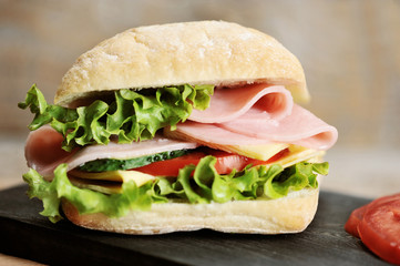 ham and cheese sandwiches on wooden Board