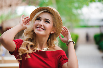 Outdoor lifestyle portrait of stylish girl laughing and smiling