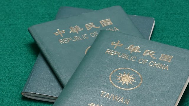 Dolly motion in on ROC passports  thrown down