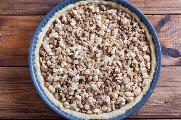 Step-by-step cooking of an open pie with mushrooms and chicken, step - cooking the filling, selective focus