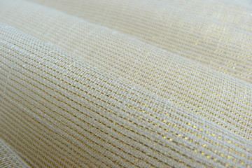 golden shiny fabric close-up macro background decor brocade silk organza textile