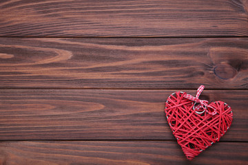 Red heart on a brown wooden table. Valentines day