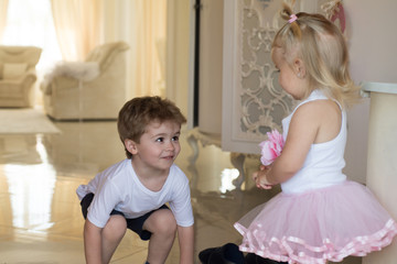 Hair state of mind. Childhood games. Children development. Small children with stylish hairstyles. Small boy and girl with blond hair. Brother and sister play together. Embrace your hairstyle