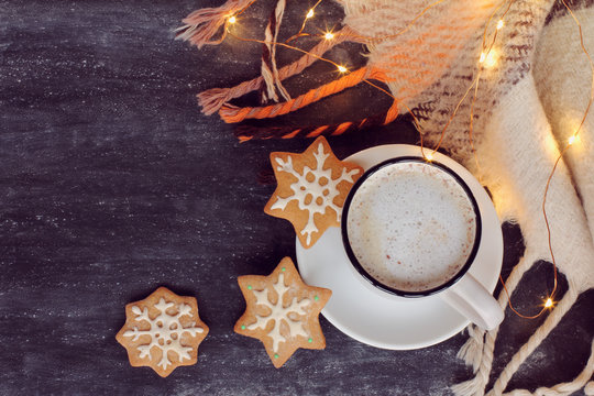 winter warming coffee/ frothy cappuccino, three ginger snowflakes and plaid with garland lights 