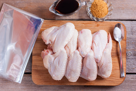 Step-by-step cooking of chicken wings with spices and soy sauce in a baking bag, recipe