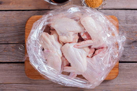 Step-by-step cooking of chicken wings with spices and soy sauce in a baking bag, recipe