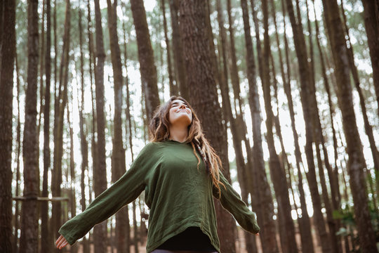 Young Woman Hiker Relaxing In The Woods