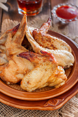 Cooked chicken wings, selective focus