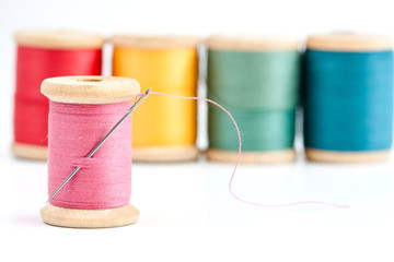 Old wooden coils of thread.