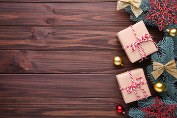 Christmas gifts presents with decorations on a brown background.
