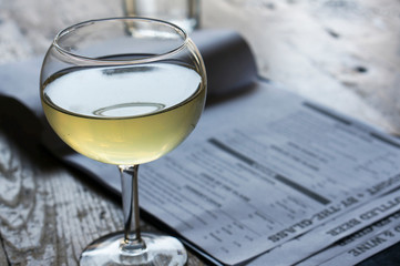A glass of the white vine