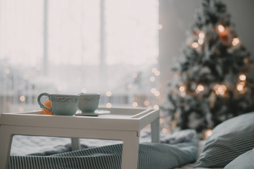 Interior of a bedroom on a Christmas morning. New Year's morning. Elements of the decor of the christmas decoration of the bedroom