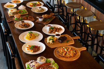 Mixed western and fusion food plates on table