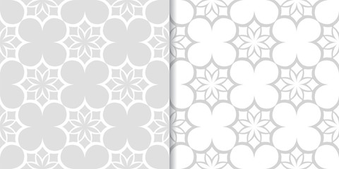 Light gray floral backgrounds. Set of seamless patterns © Liudmyla