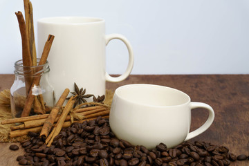 Coffee with cinnamon  on a wooden table. View from above