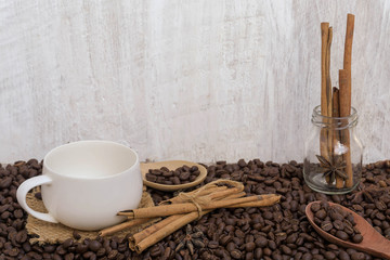 Coffee with cinnamon  on a wooden table. View from above