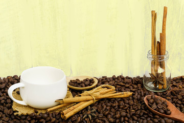 Coffee with cinnamon  on a wooden table. View from above