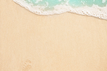 Fototapeta na wymiar Beautiful soft wave on the sandy beach background