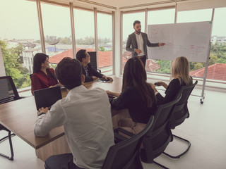 business people in board room,Businessman explaining new business ideas