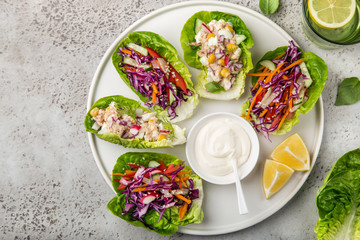  various lettuce wraps  on white plate