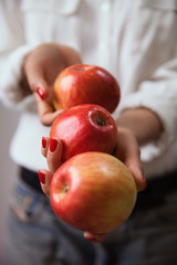 Young woman hands with apple