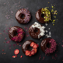 baked chocolate donuts with various topping