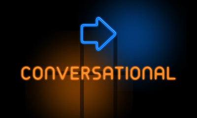 Fototapeta premium Conversational - orange glowing text with an arrow on dark background